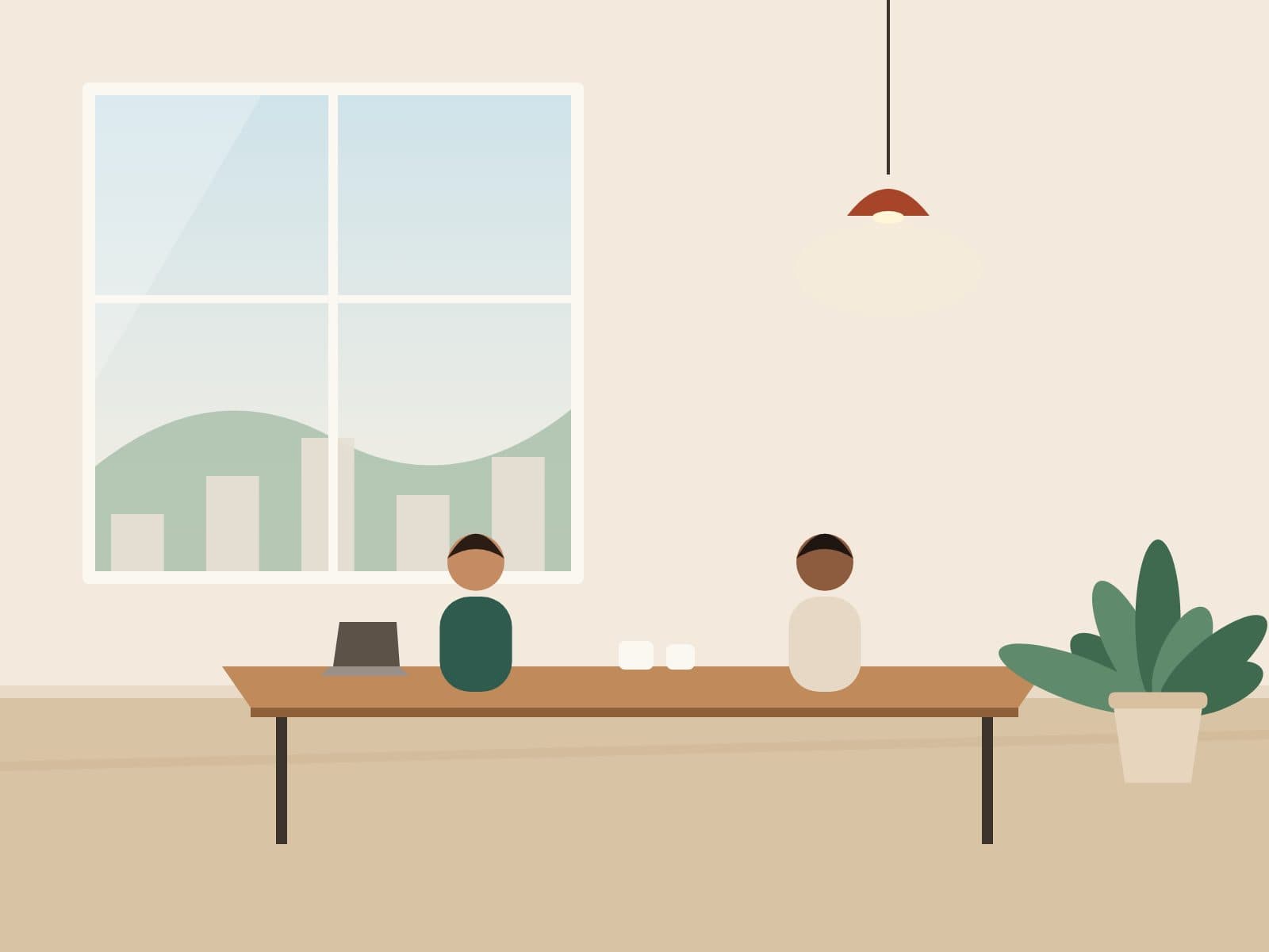 Two professionals talking at a shared table